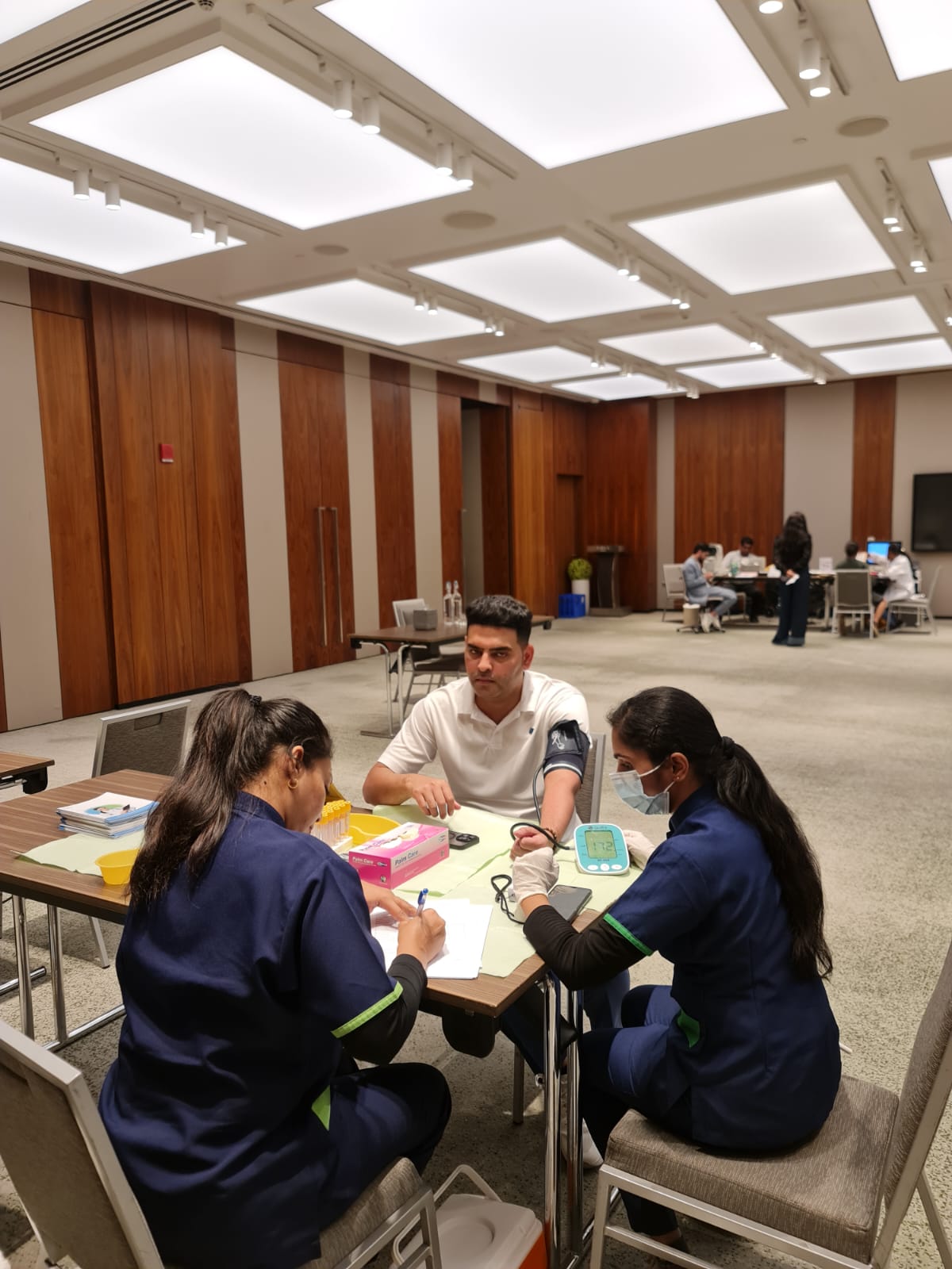Medilife nurses attending to a patient at an on-site health screening in Dubai
